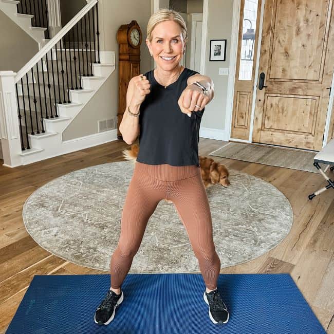 woman showing air punches to tone arms without push ups